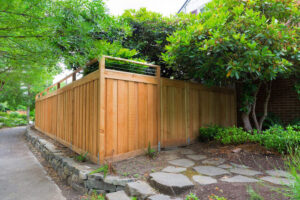 wood fence and cement blocks retaining wall