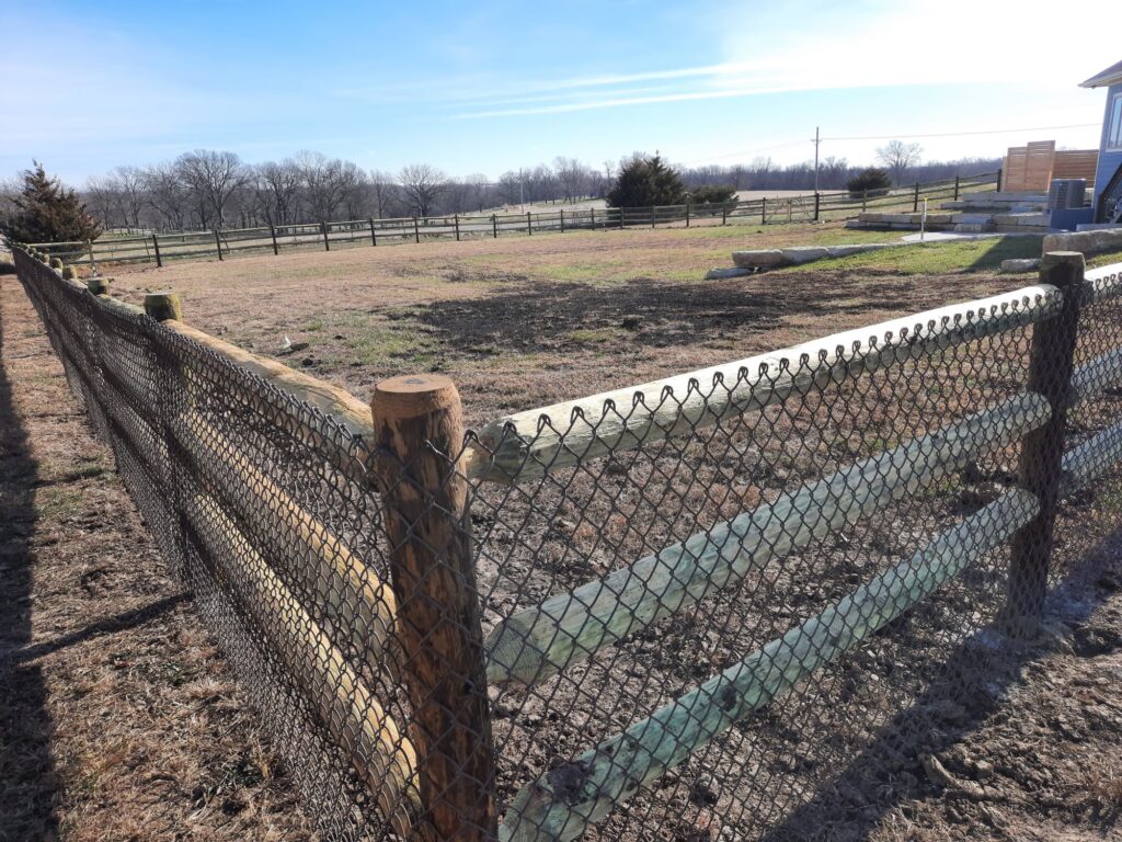 Copperwood Round Rail with chain link Fence